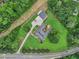 Aerial view of the home nestled on a large lot with lush landscaping at 2631 Young Rd, Stone Mountain, GA 30088