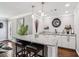 A granite topped bar area featuring pendant lights, dark wood floors and stylish decor at 2631 Young Rd, Stone Mountain, GA 30088