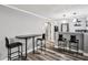 Bar area with bar and table seating and decorative pendant lights at 2631 Young Rd, Stone Mountain, GA 30088