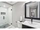 Bathroom with glass shower, modern vanity, and hexagon tile at 2631 Young Rd, Stone Mountain, GA 30088