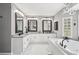 Bathroom with double vanity, granite countertops, and a modern soaking tub at 2631 Young Rd, Stone Mountain, GA 30088