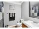 Bathroom with updated vanity, decorative sign and shower with new shower curtain at 2631 Young Rd, Stone Mountain, GA 30088