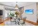 Dining area with a glass table, comfortable chairs, and large windows at 2631 Young Rd, Stone Mountain, GA 30088