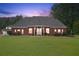 Beautiful red brick home features a spacious front yard, manicured lawn, and classic architectural details at 2631 Young Rd, Stone Mountain, GA 30088