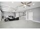 A spacious garage featuring epoxy floors, ceiling fans, and a convenient wet bar for entertaining at 2631 Young Rd, Stone Mountain, GA 30088