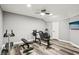Home gym boasts updated flooring and modern ceiling fan at 2631 Young Rd, Stone Mountain, GA 30088