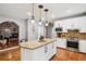 Modern kitchen with a center island, granite countertops, and stainless steel appliances at 2631 Young Rd, Stone Mountain, GA 30088