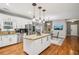 Bright kitchen featuring a granite island, stainless steel appliances, and hardwood floors at 2631 Young Rd, Stone Mountain, GA 30088