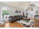 Spacious living room with vaulted ceilings, large windows, and a comfortable seating area at 2631 Young Rd, Stone Mountain, GA 30088