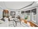 Bright living room with neutral paint, hardwood floors, and large windows providing natural light at 2631 Young Rd, Stone Mountain, GA 30088