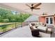 Inviting porch featuring comfortable seating, ceiling fans, and a peaceful backyard view for relaxation at 2631 Young Rd, Stone Mountain, GA 30088