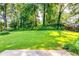 A large grassy lawn in the expansive backyard at 516 Jordan Nw Dr, Tucker, GA 30084
