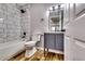 Bathroom features modern fixtures, vanity and marble tiled shower at 516 Jordan Nw Dr, Tucker, GA 30084