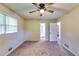 Bedroom showcasing a ceiling fan and doorway leading to bathroom at 516 Jordan Nw Dr, Tucker, GA 30084