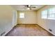 Bright bedroom with natural light, ceiling fan, and carpeted floors at 516 Jordan Nw Dr, Tucker, GA 30084