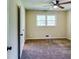 Cozy bedroom with natural lighting, ceiling fan, carpet flooring, and standard closet at 516 Jordan Nw Dr, Tucker, GA 30084