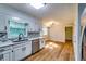 Modern kitchen with new white cabinets, quartz countertops, and stainless appliances at 516 Jordan Nw Dr, Tucker, GA 30084