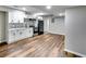 Basement kitchen with white cabinets, mosaic backsplash, and stainless steel appliances at 516 Jordan Nw Dr, Tucker, GA 30084