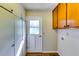 Well-lit laundry room offers built-in storage and backyard access at 516 Jordan Nw Dr, Tucker, GA 30084