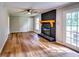 Spacious living room with a fireplace and hardwood floors is a perfect place to relax at 516 Jordan Nw Dr, Tucker, GA 30084