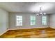Spacious living room with luxury vinyl floors and lots of natural light at 516 Jordan Nw Dr, Tucker, GA 30084