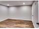 Neutral colored room with hard wood flooring and recessed lighting at 516 Jordan Nw Dr, Tucker, GA 30084