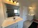 Spacious primary bathroom featuring double sink vanity and separate tub and shower at 5290 Hidden Valley Ln, Cumming, GA 30028