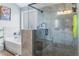 Bathroom with grey tiled walk-in shower, separate soaking tub, and tiled floors at 5290 Hidden Valley Ln, Cumming, GA 30028