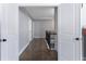 Upstairs hallway featuring hardwood floors and neutral gray paint at 5290 Hidden Valley Ln, Cumming, GA 30028