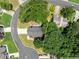 Beautiful aerial view of home on cul-de-sac lot surrounded by mature trees at 1520 Dorchester Dr, Lawrenceville, GA 30043