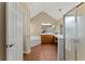Bathroom showcasing a walk-in shower, soaking tub, and double vanity sinks with stylish fixtures at 1520 Dorchester Dr, Lawrenceville, GA 30043