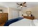 Spacious bedroom with a ceiling fan, hardwood floors, a large closet, and ample natural light at 1520 Dorchester Dr, Lawrenceville, GA 30043
