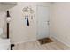 Charming entryway features a coat rack, stylish wallpaper, and a bike-themed doormat for a welcoming touch at 1520 Dorchester Dr, Lawrenceville, GA 30043