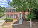 Charming two-story brick home with landscaped yard and welcoming front entrance at 1520 Dorchester Dr, Lawrenceville, GA 30043