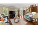 Cozy living room with hardwood floors and plenty of natural light at 1520 Dorchester Dr, Lawrenceville, GA 30043