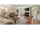 Cozy living room featuring a fireplace, comfortable seating, and a ceiling fan at 1520 Dorchester Dr, Lawrenceville, GA 30043