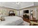 Bright and airy main bedroom with tray ceilings, wood floors, and double doors at 1520 Dorchester Dr, Lawrenceville, GA 30043