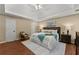 Large main bedroom with trey ceiling, area rug, and decorative lamps at 1520 Dorchester Dr, Lawrenceville, GA 30043