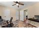 Bright home office with hardwood floors, a ceiling fan, and a computer desk at 1520 Dorchester Dr, Lawrenceville, GA 30043
