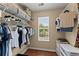 Well-organized walk-in closet with wire shelving and hanging rods, providing ample storage space at 1520 Dorchester Dr, Lawrenceville, GA 30043