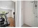 Newly renovated bathroom with a tiled shower, and an exercise room adjacent at 4875 Churchill Ridge Dr, Cumming, GA 30028