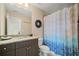 Lovely bathroom with granite countertop vanity, mirror, and decorative wreath at 4875 Churchill Ridge Dr, Cumming, GA 30028