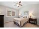 Bedroom with vaulted ceiling, ceiling fan, and two bedside tables at 4875 Churchill Ridge Dr, Cumming, GA 30028