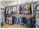 Walk-in closet with custom shelving, providing ample storage for clothing and accessories at 4875 Churchill Ridge Dr, Cumming, GA 30028