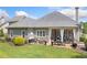 Exterior of house with view of the patio, landscaping and roof at 4875 Churchill Ridge Dr, Cumming, GA 30028