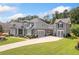 Lovely home with attached two-car garage, long driveway, and well-maintained landscaping at 4875 Churchill Ridge Dr, Cumming, GA 30028