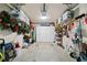 Garage with overhead storage, organized tools and holiday decorations at 4875 Churchill Ridge Dr, Cumming, GA 30028