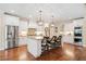 Bright kitchen with stainless steel appliances, a central island, and hardwood floors at 4875 Churchill Ridge Dr, Cumming, GA 30028