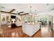 Open concept living and kitchen area featuring an island and fireplace with custom cabinets at 4875 Churchill Ridge Dr, Cumming, GA 30028
