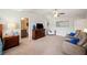 Bright and spacious main bedroom with sitting area and a view of the bathroom at 4875 Churchill Ridge Dr, Cumming, GA 30028